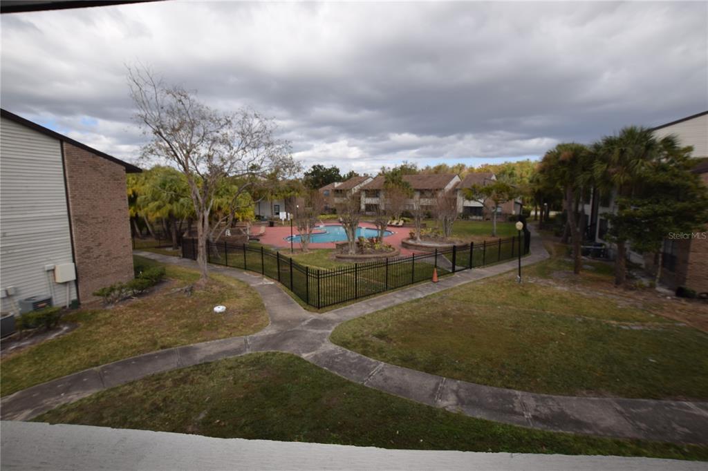 4659 Cason Cove Drive, Unit 3022 Orlando, FL 32811 - Photo 29 of 29 a view of a backyard