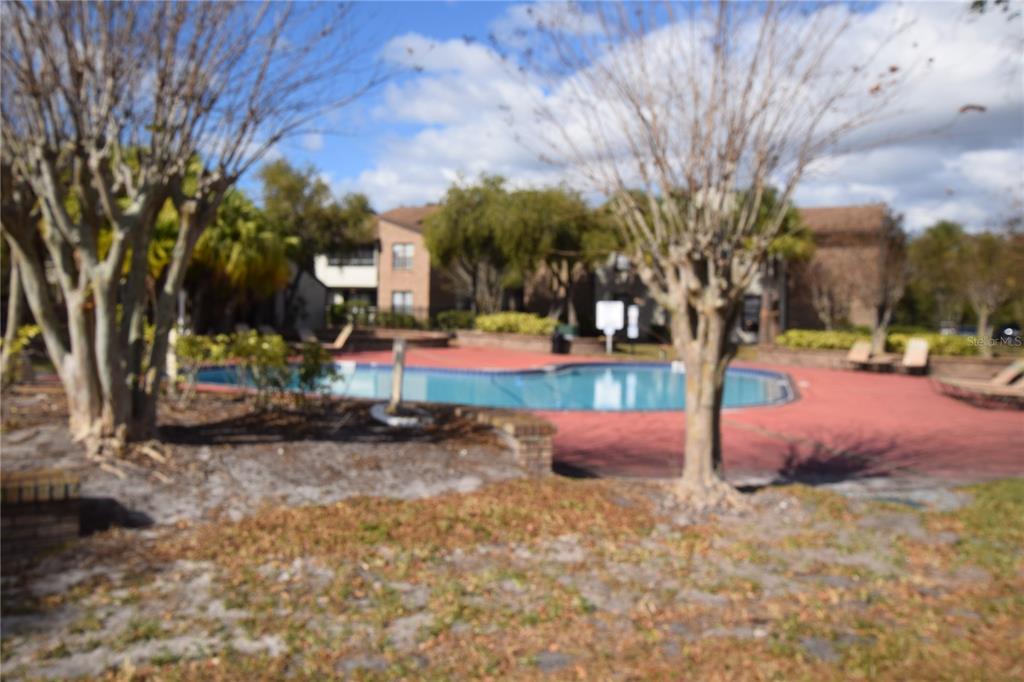 4659 Cason Cove Drive, Unit 3022 Orlando, FL 32811 - Photo 5 of 29 a childrens park with lots of swings and slides