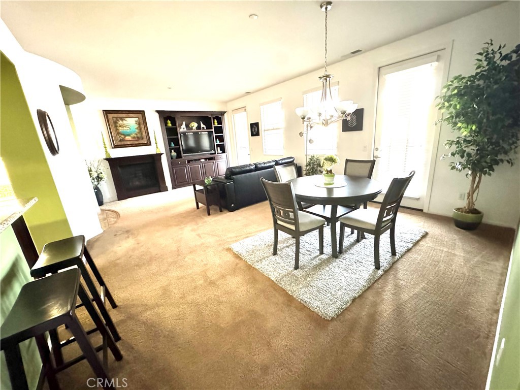 7666 Papyrus Place, Unit 2 Rancho Cucamonga, CA 91739 - Photo 11 of 23 a living room with furniture and a flat screen tv