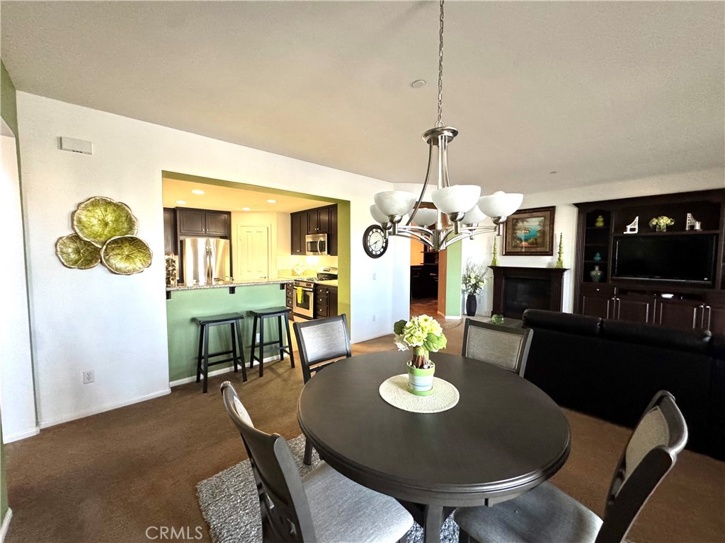 7666 Papyrus Place, Unit 2 Rancho Cucamonga, CA 91739 - Photo 12 of 23 a view of a dining room with furniture