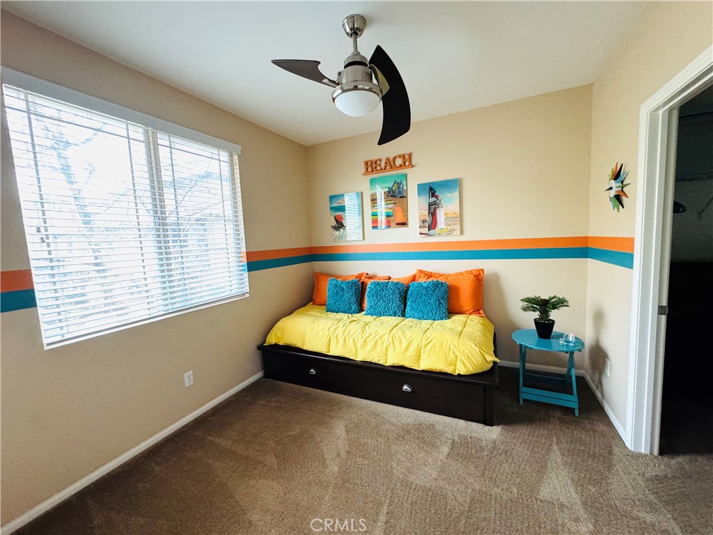 7666 Papyrus Place, Unit 2 Rancho Cucamonga, CA 91739 - Photo 20 of 23 a bed sitting in a bedroom next to a window