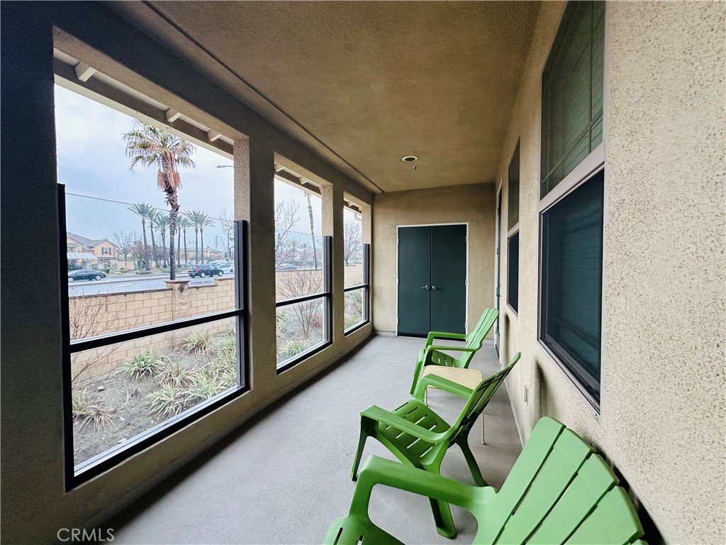 7666 Papyrus Place, Unit 2 Rancho Cucamonga, CA 91739 - Photo 23 of 23 a living room with furniture large window and a flat screen tv