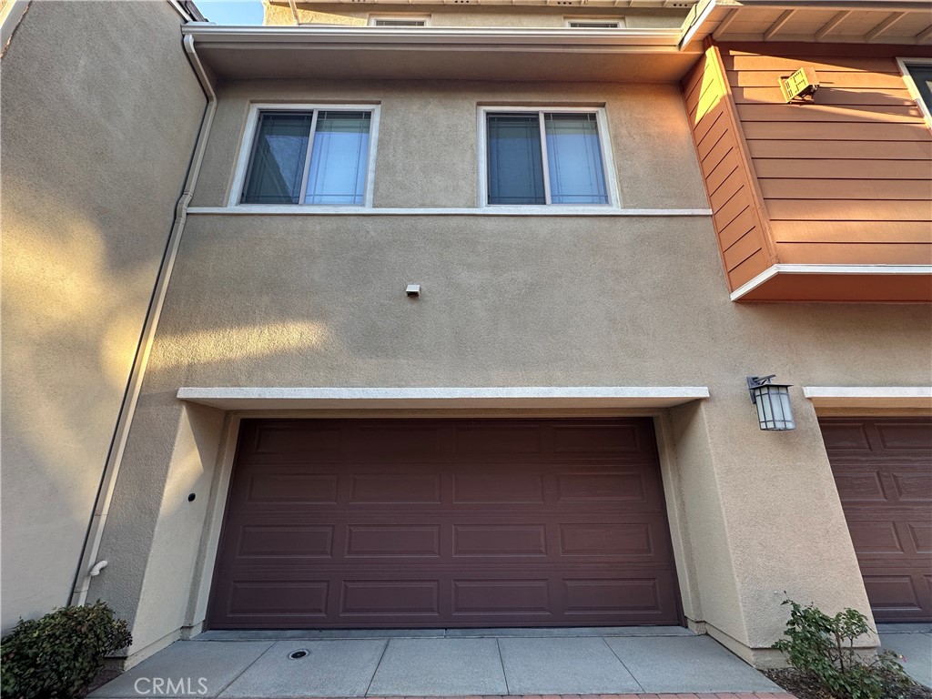 7666 Papyrus Place, Unit 2 Rancho Cucamonga, CA 91739 - Photo 4 of 23 a building with a door