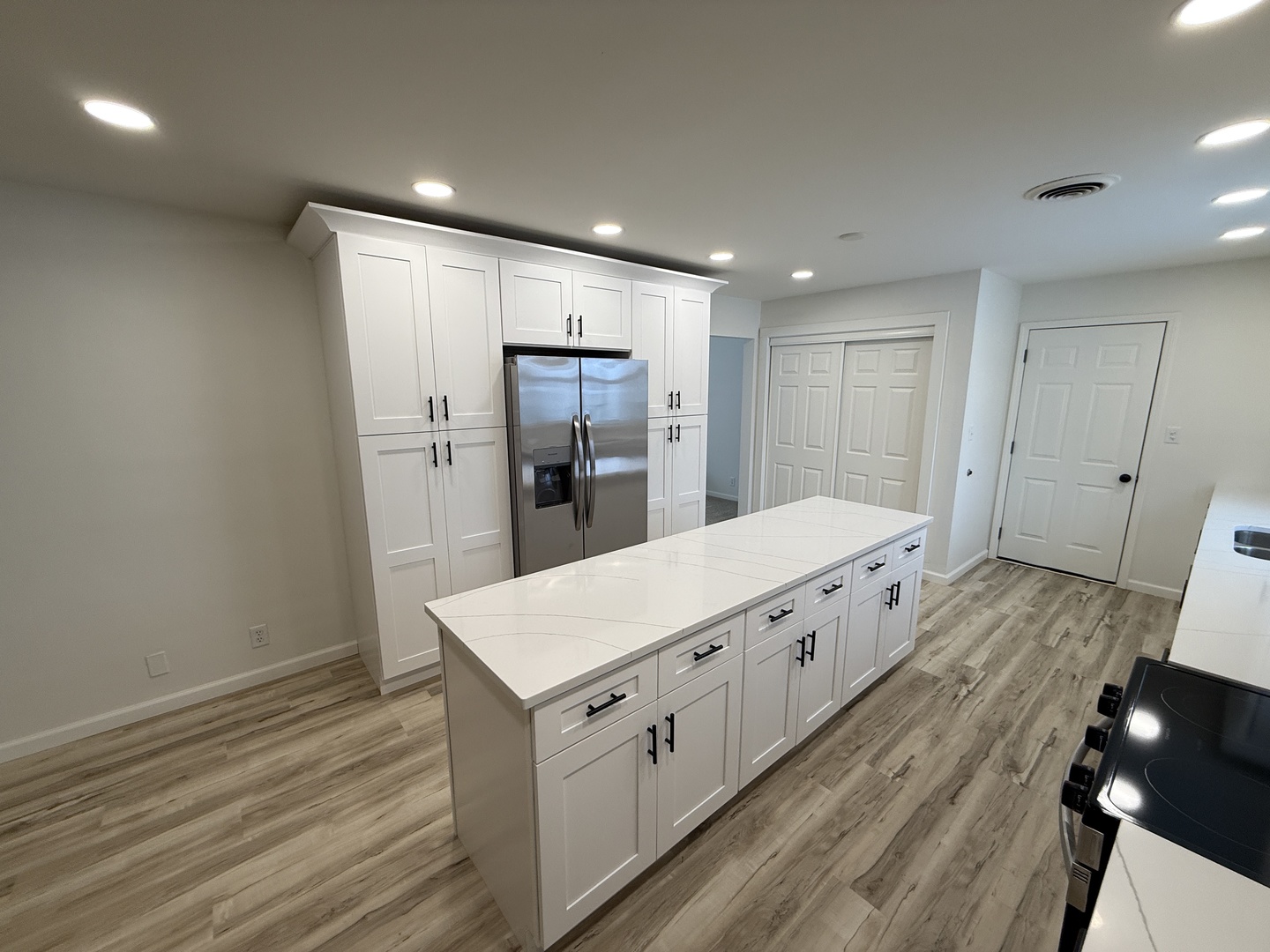 185 Jacqueline Street Morris, IL 60450 - Photo 6 of 19 a large white kitchen with wooden floor