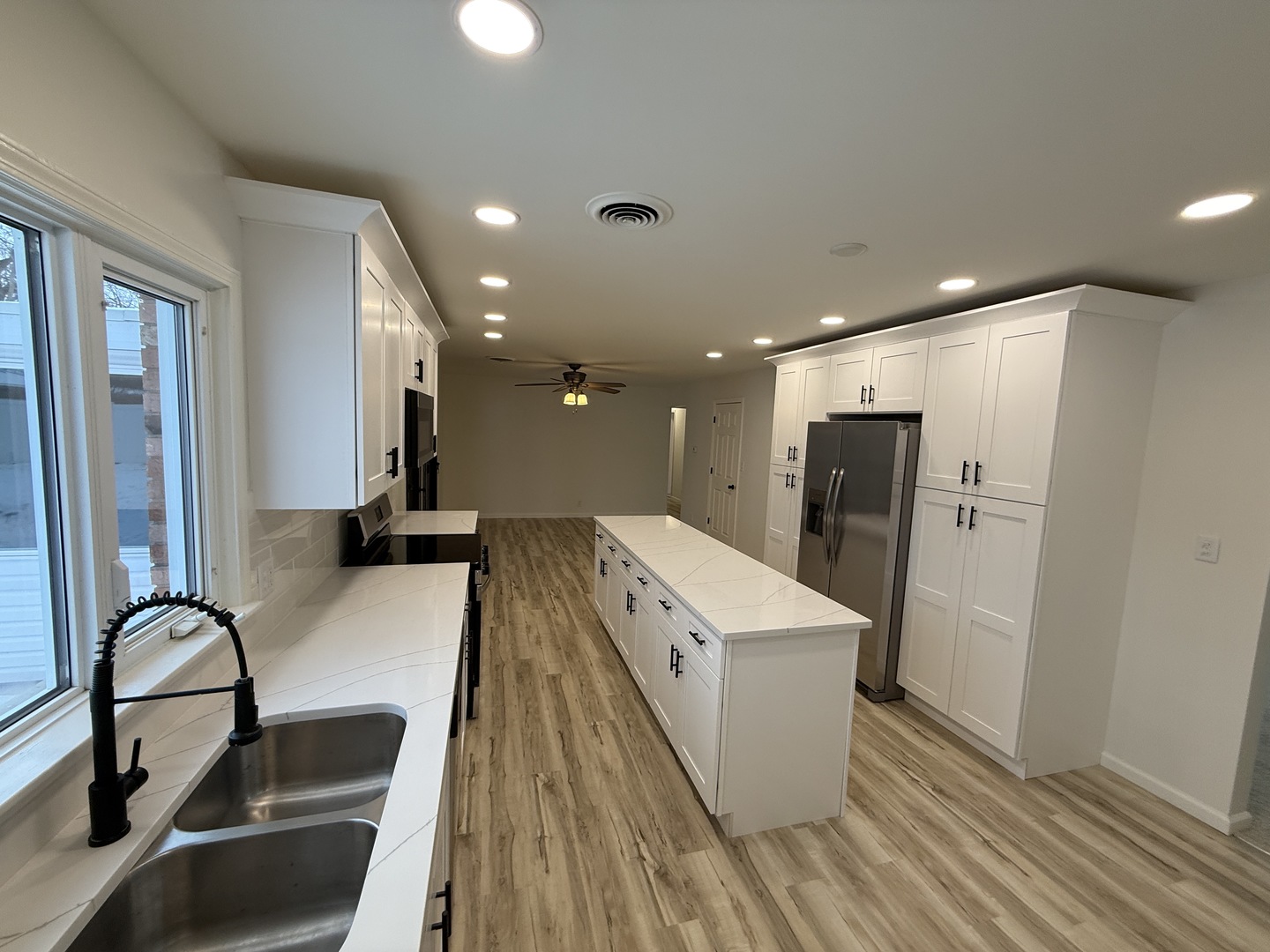 185 Jacqueline Street Morris, IL 60450 - Photo 8 of 19 a large kitchen with stainless steel appliances a large counter top a refrigerator and a sink