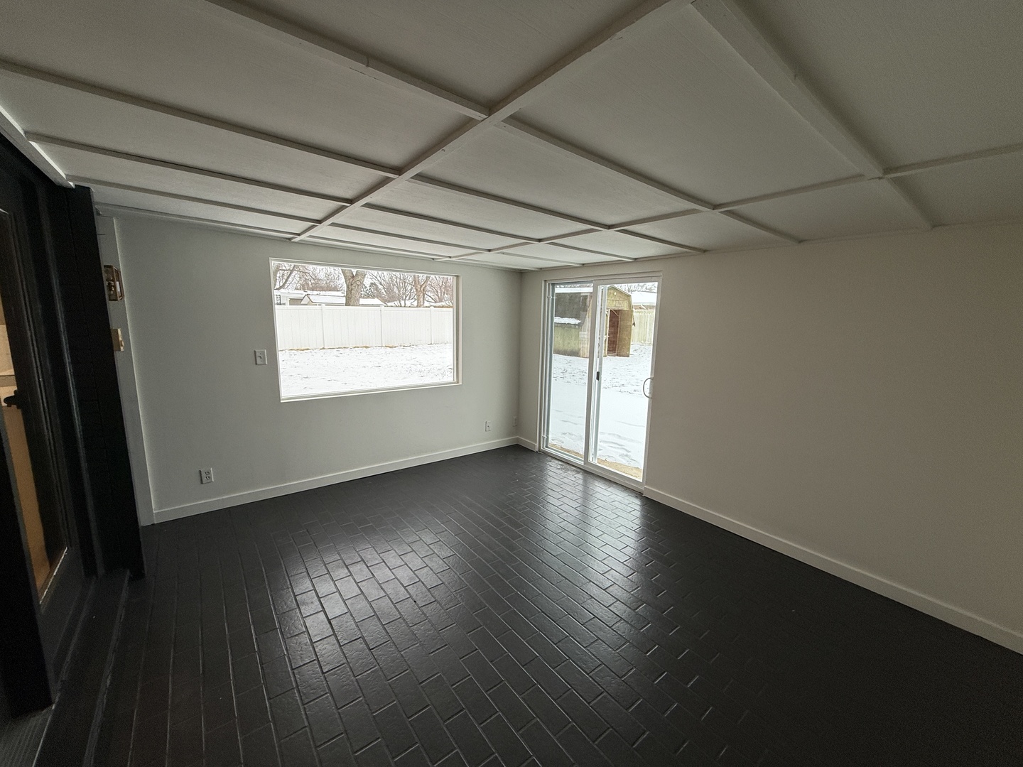 185 Jacqueline Street Morris, IL 60450 - Photo 9 of 19 a view of an empty room with wooden floor and a window