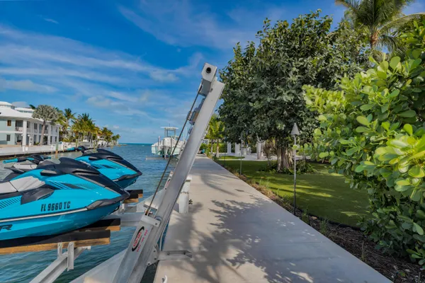 a view of a house with swimming pool and porch with furniture