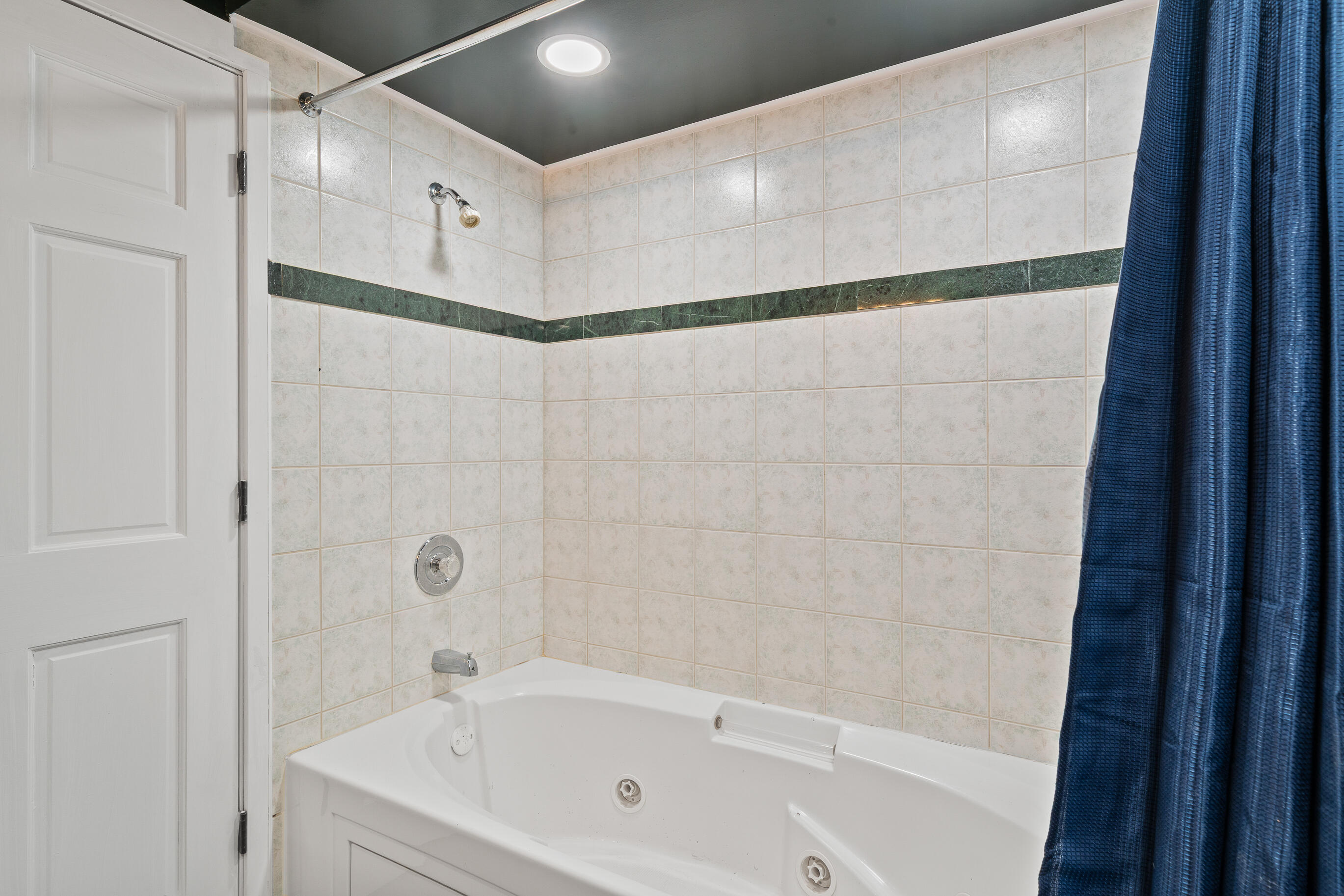 2212 Borg Road Delavan, WI 53115 - Photo 33 of 43 Lower level jetted tub/shower combo with tile surround and green marble accent strip