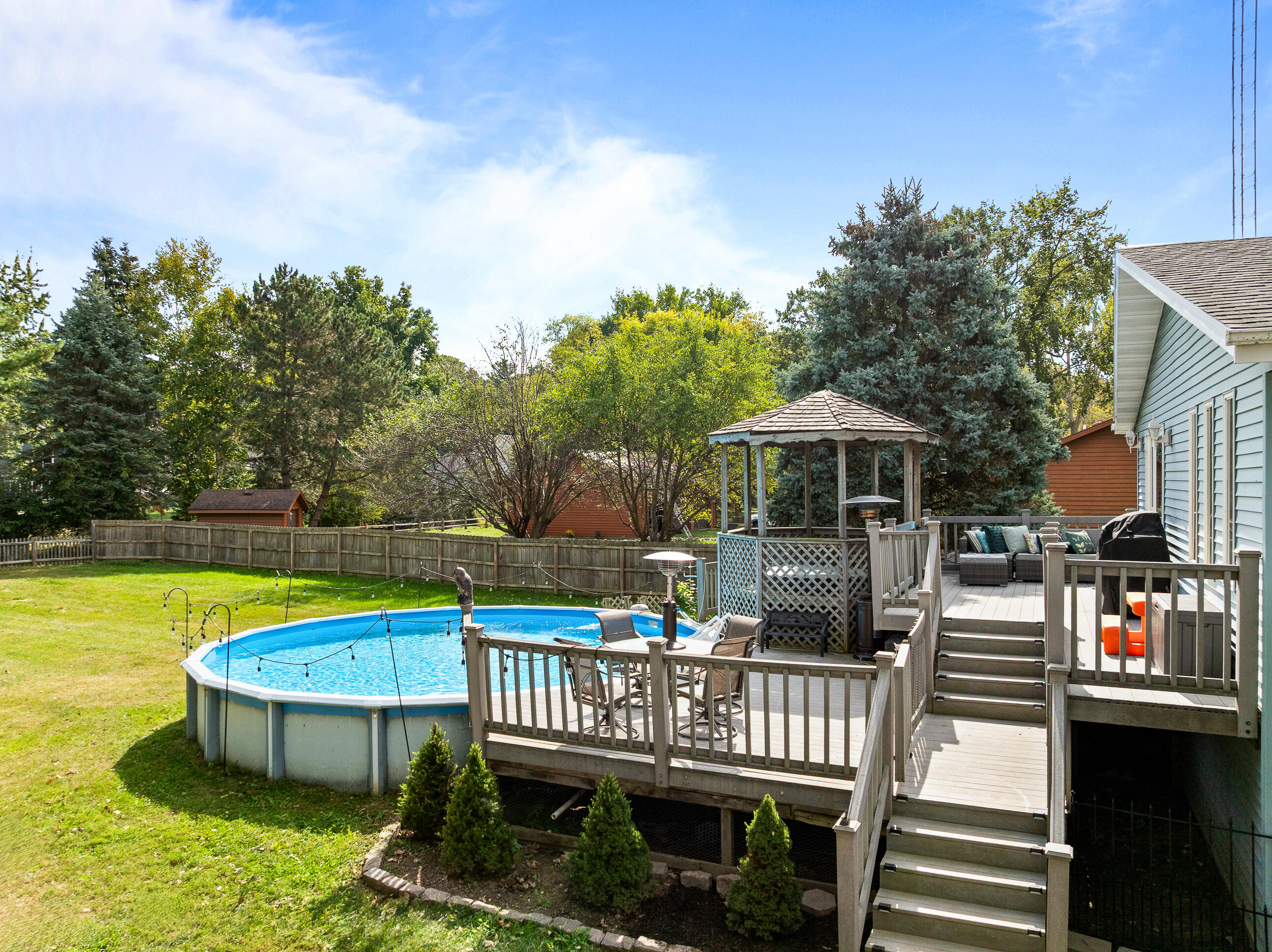 2212 Borg Road Delavan, WI 53115 - Photo 5 of 15 Entertain all summer long. Above-ground pool, wraparound deck with built-in steps, octagonal gazebo with hot tub, and outdoor seating.