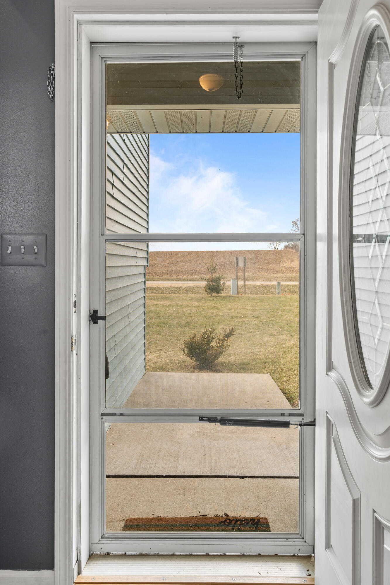 2212 Borg Road Delavan, WI 53115 - Photo 6 of 43 Covered front porch entry with storm door and decorative front door with oval glass insert