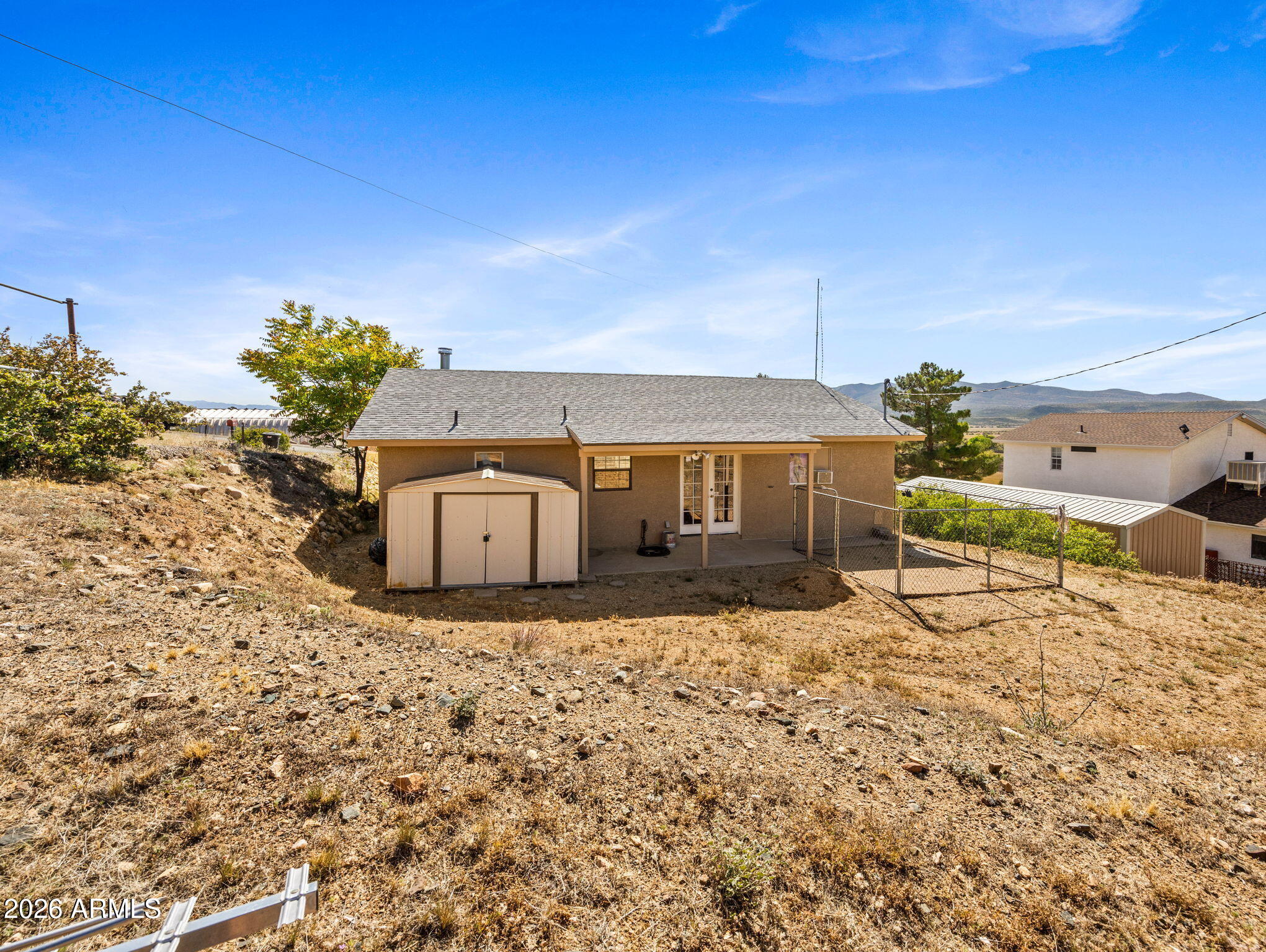 18420 Peeples Valley Road Peeples Valley, AZ 86332 - Photo 4 of 31 a view of a house with a yard
