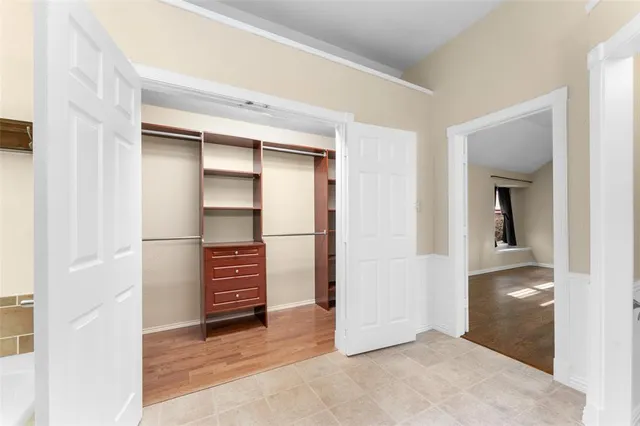 an empty room with closet and cabinet