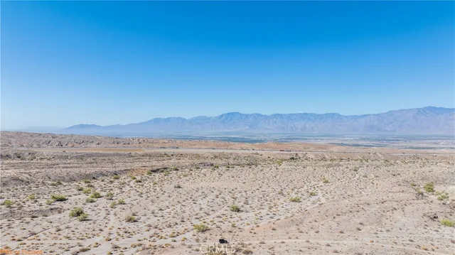 a view of ocean and mountain