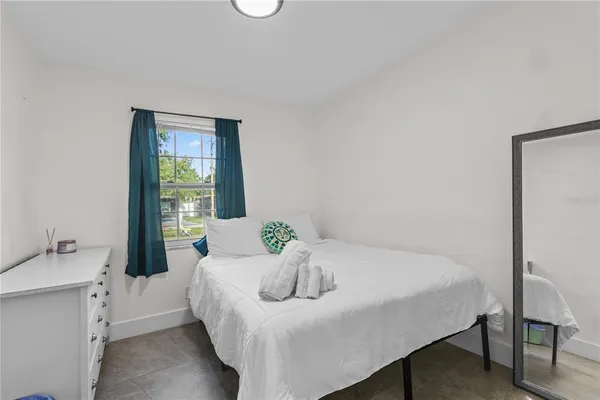 a bedroom with a bed and a table