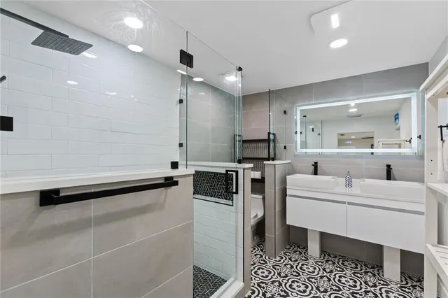 a kitchen with a sink cabinets and stainless steel appliances