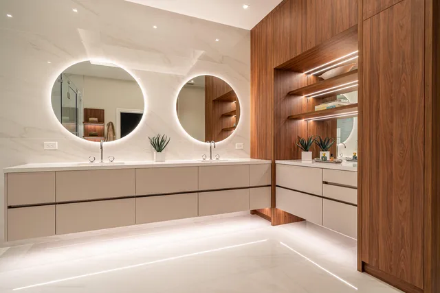 a bathroom with a double vanity sink and mirror