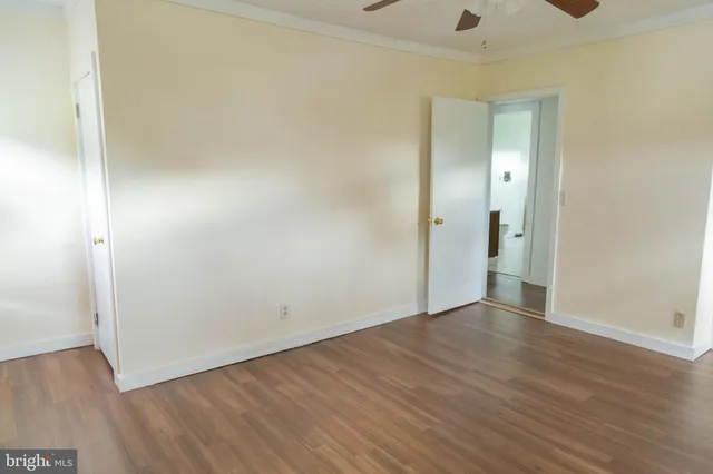 a bathroom with a sink a toilet and shower curtain
