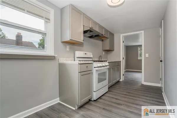 a kitchen with stainless steel appliances a stove and a refrigerator