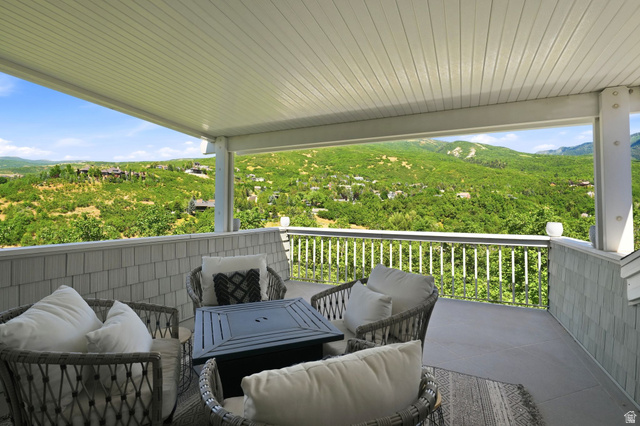 1979 Cave Hollow Way Bountiful, UT 84010 - Photo 46 of 59 Master Private Deck Sitting Area, Covered patio featuring a slatted ceiling and white railing
