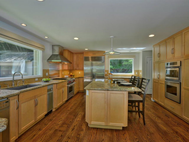 5500 Alpine Road Portola Valley, CA 94028 - Photo 12 of 24 a kitchen with stainless steel appliances granite countertop a stove and a refrigerator
