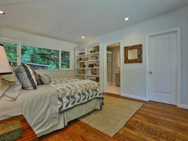 5500 Alpine Road Portola Valley, CA 94028 - Photo 17 of 24 a bedroom with a bed a dresser and a large window