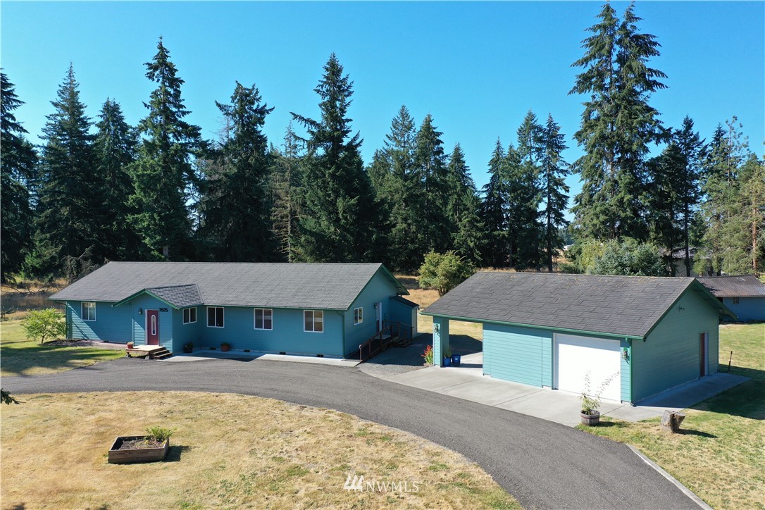 7625 187th Avenue Southwest Rochester, WA 98579 - Photo 1 of 38 a view of a house with a yard