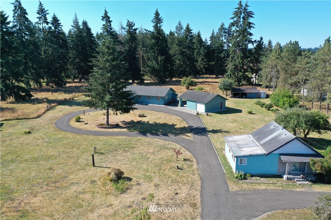 7625 187th Avenue Southwest Rochester, WA 98579 - Photo 2 of 38 a view of swimming pool with a patio