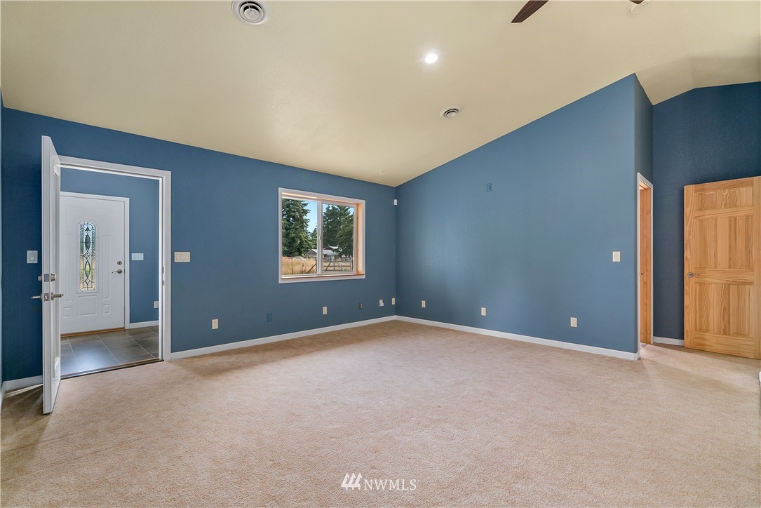 7625 187th Avenue Southwest Rochester, WA 98579 - Photo 12 of 38 a view of an empty room with a window
