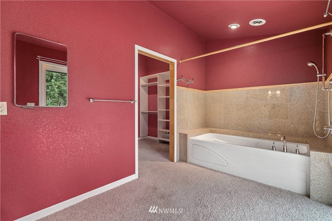 7625 187th Avenue Southwest Rochester, WA 98579 - Photo 17 of 38 a spacious bathroom with a bathtub and a shower