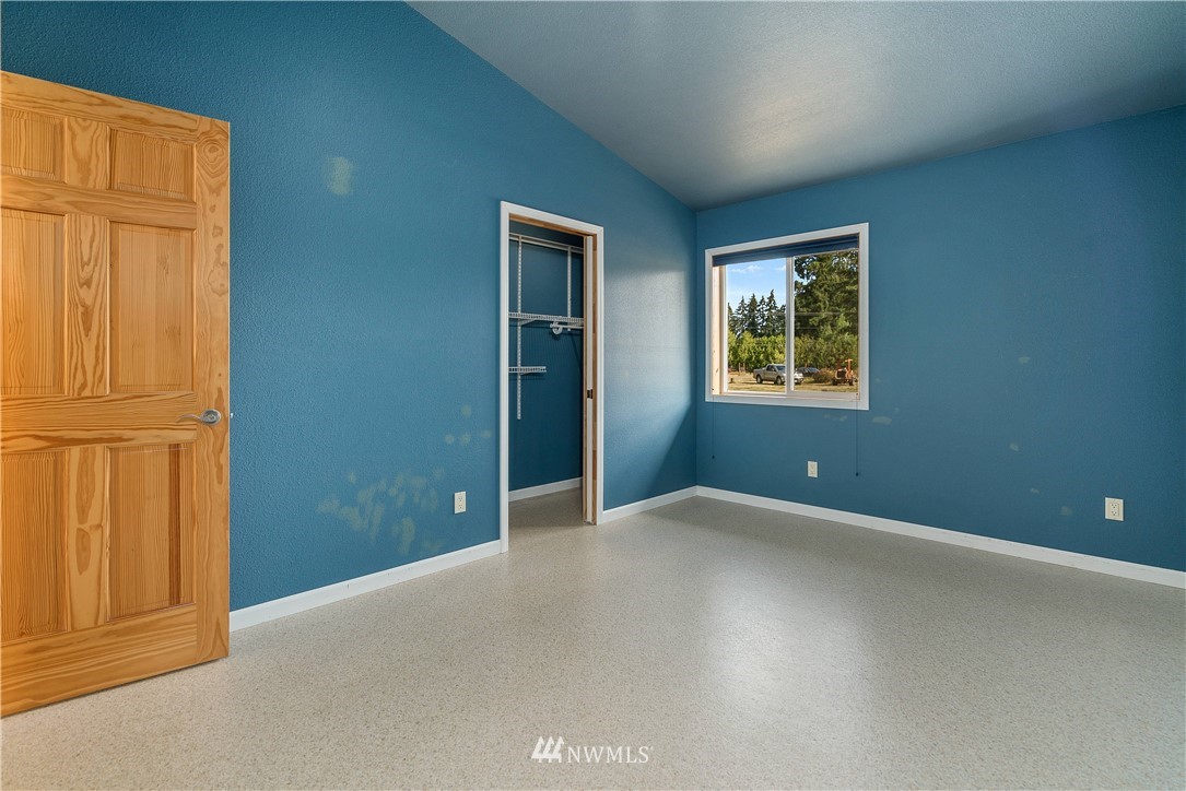 7625 187th Avenue Southwest Rochester, WA 98579 - Photo 20 of 38 an empty room with windows