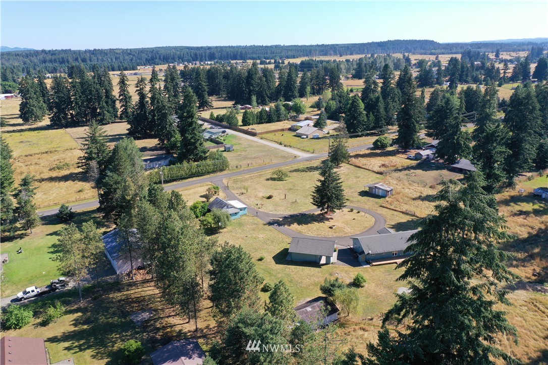 7625 187th Avenue Southwest Rochester, WA 98579 - Photo 3 of 38 an aerial view of residential houses with outdoor space