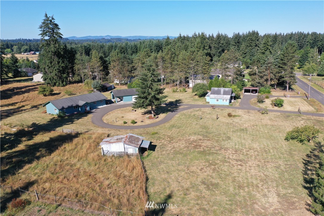7625 187th Avenue Southwest Rochester, WA 98579 - Photo 29 of 38 a view of a backyard of a house