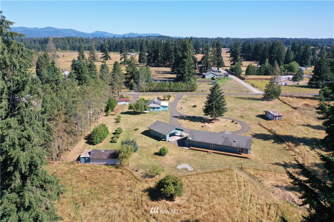 7625 187th Avenue Southwest Rochester, WA 98579 - Photo 31 of 38 a view of a lake with a mountain view