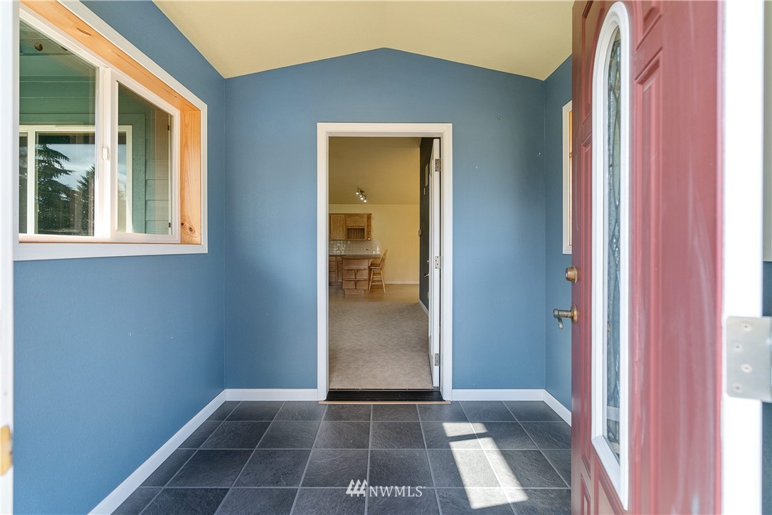 7625 187th Avenue Southwest Rochester, WA 98579 - Photo 5 of 38 a view of hallway with windows