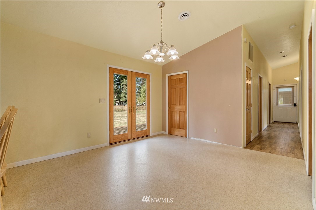 7625 187th Avenue Southwest Rochester, WA 98579 - Photo 8 of 38 a view of a livingroom with a chandelier fan