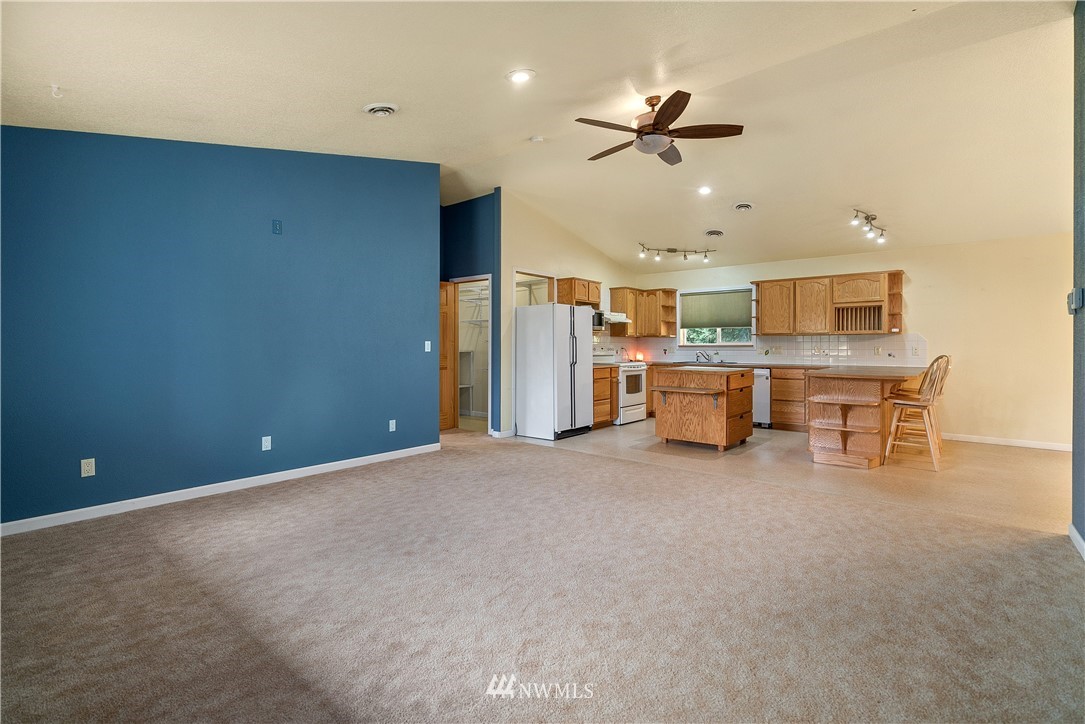 7625 187th Avenue Southwest Rochester, WA 98579 - Photo 10 of 38 a view of a livingroom with a kitchen