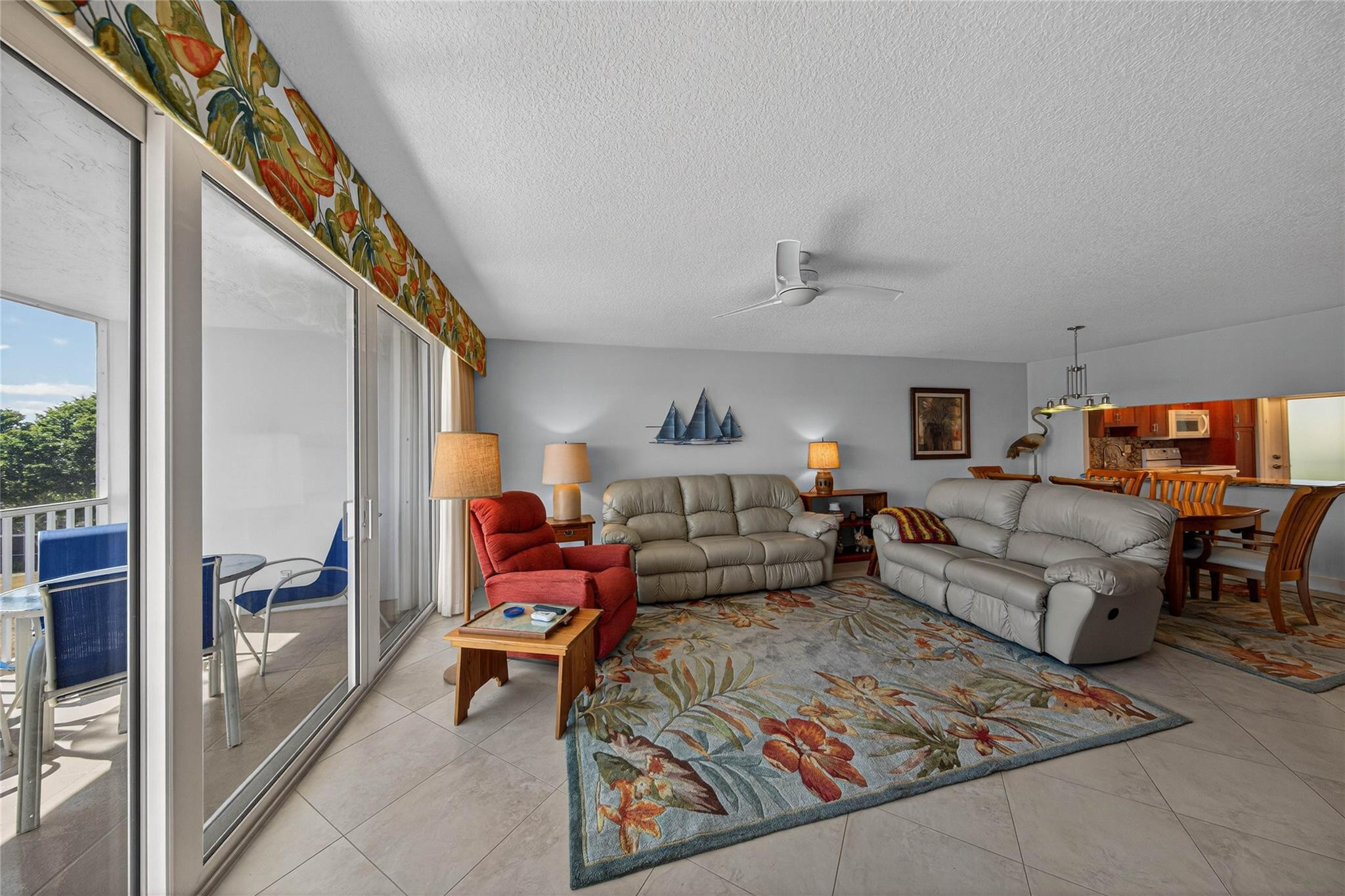3150 Northeast 48th Court, Unit 414 Lighthouse Point, FL 33064 - Photo 15 of 33 a living room with furniture and a rug