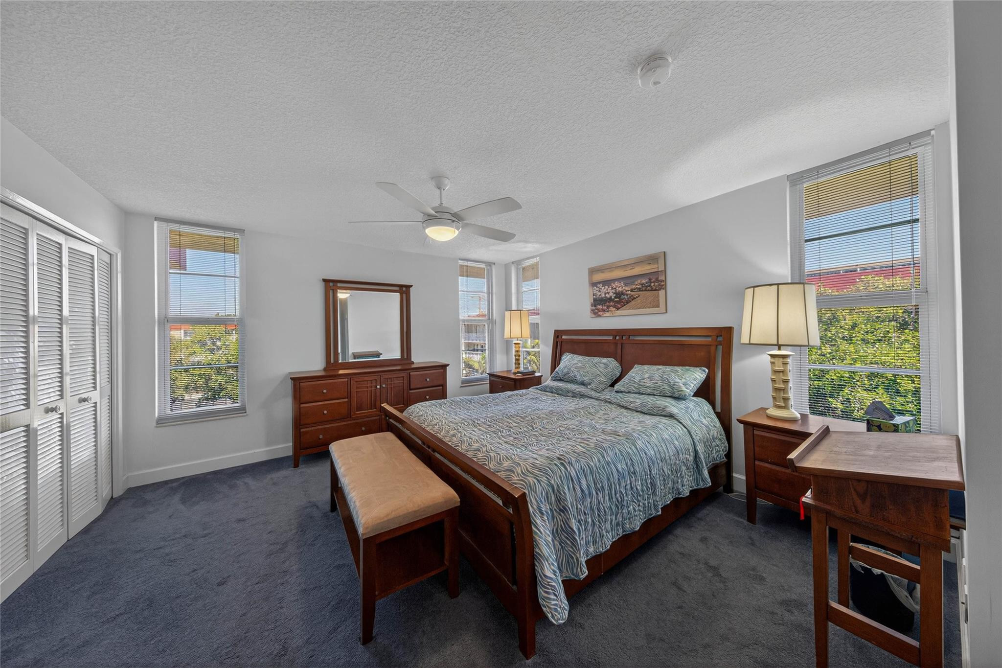 3150 Northeast 48th Court, Unit 414 Lighthouse Point, FL 33064 - Photo 17 of 33 a bedroom with a bed and a window