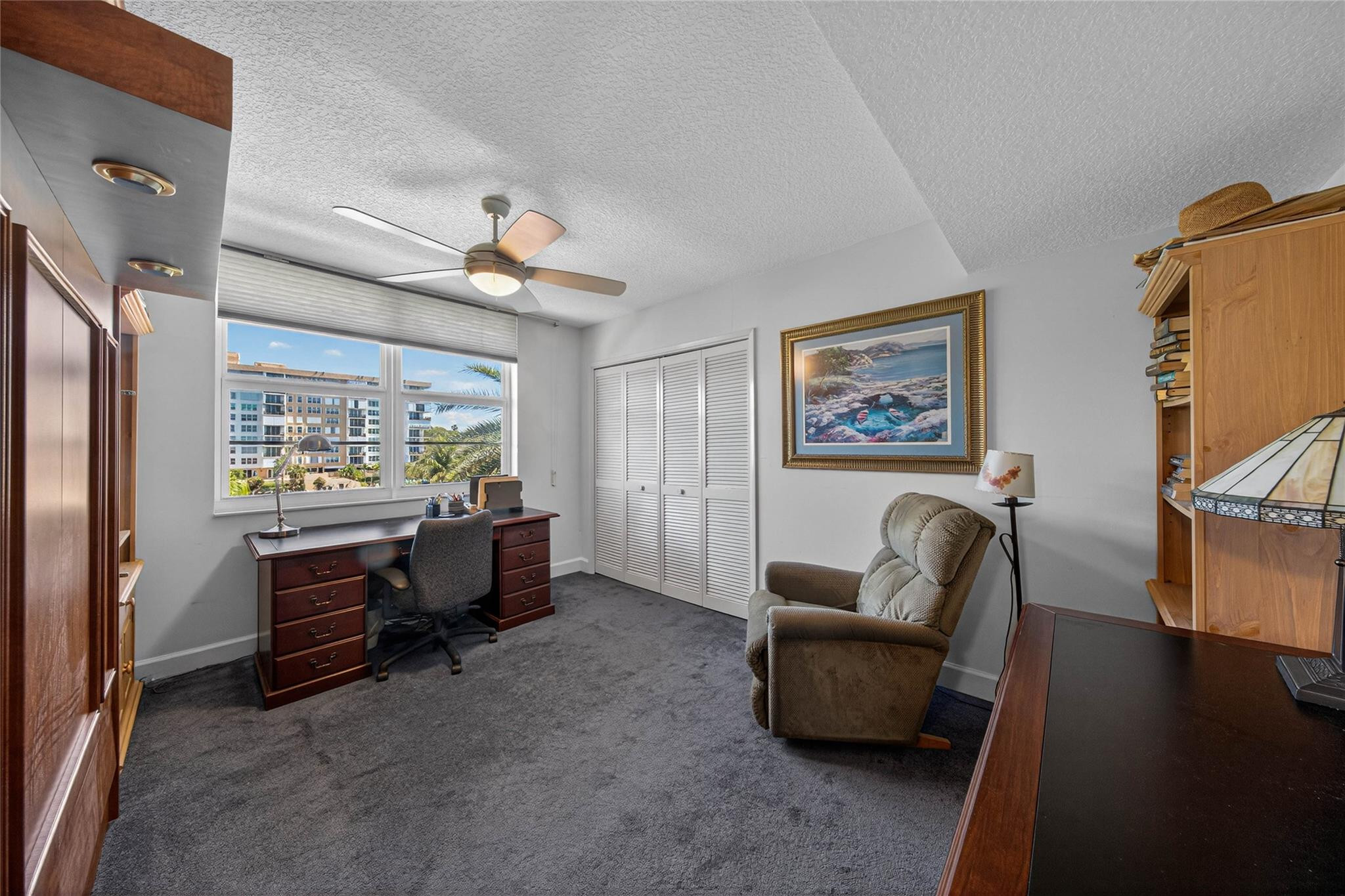 3150 Northeast 48th Court, Unit 414 Lighthouse Point, FL 33064 - Photo 20 of 33 a living room with furniture and a window