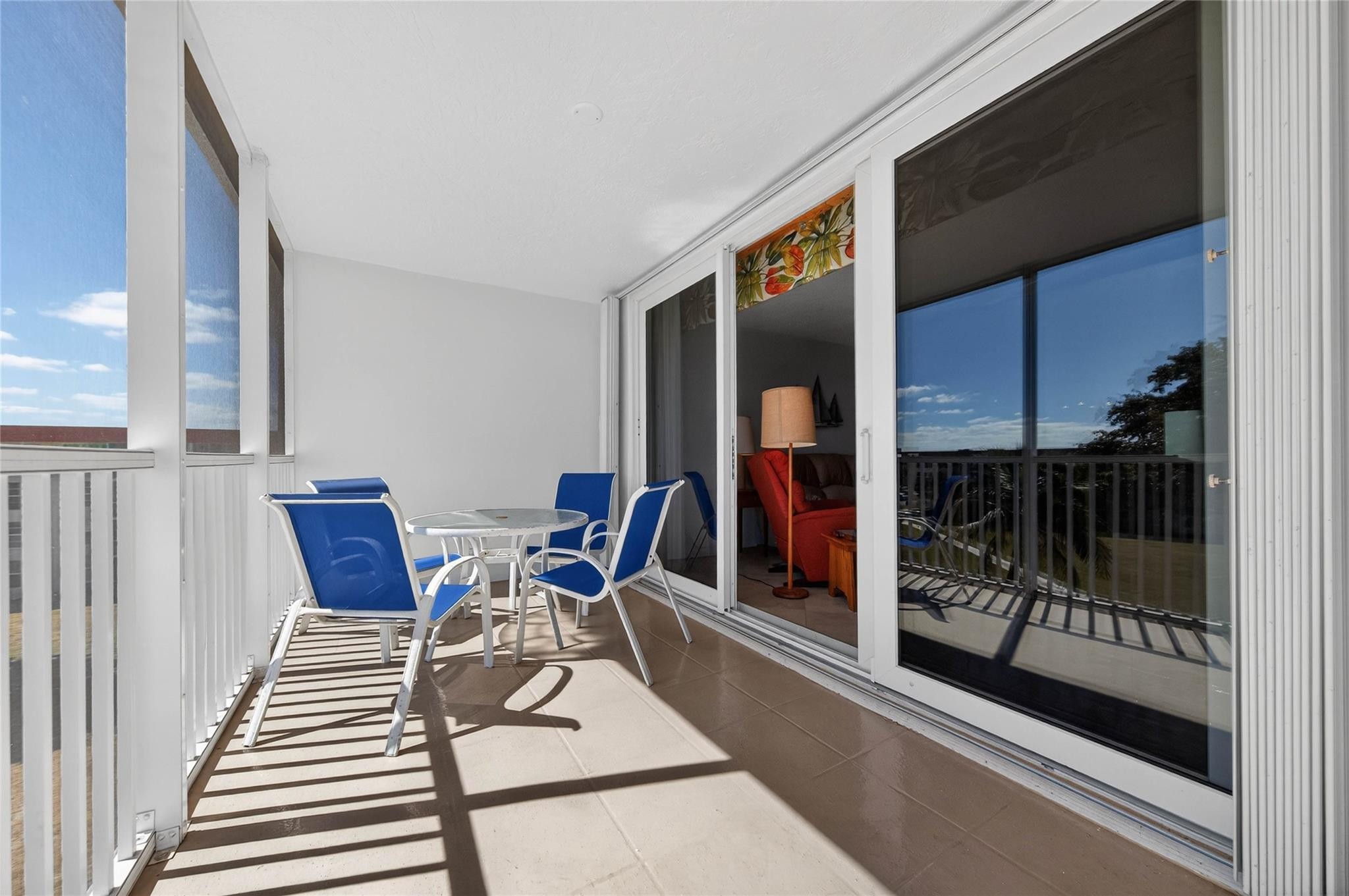 3150 Northeast 48th Court, Unit 414 Lighthouse Point, FL 33064 - Photo 26 of 33 a view of a chairs and table in a balcony