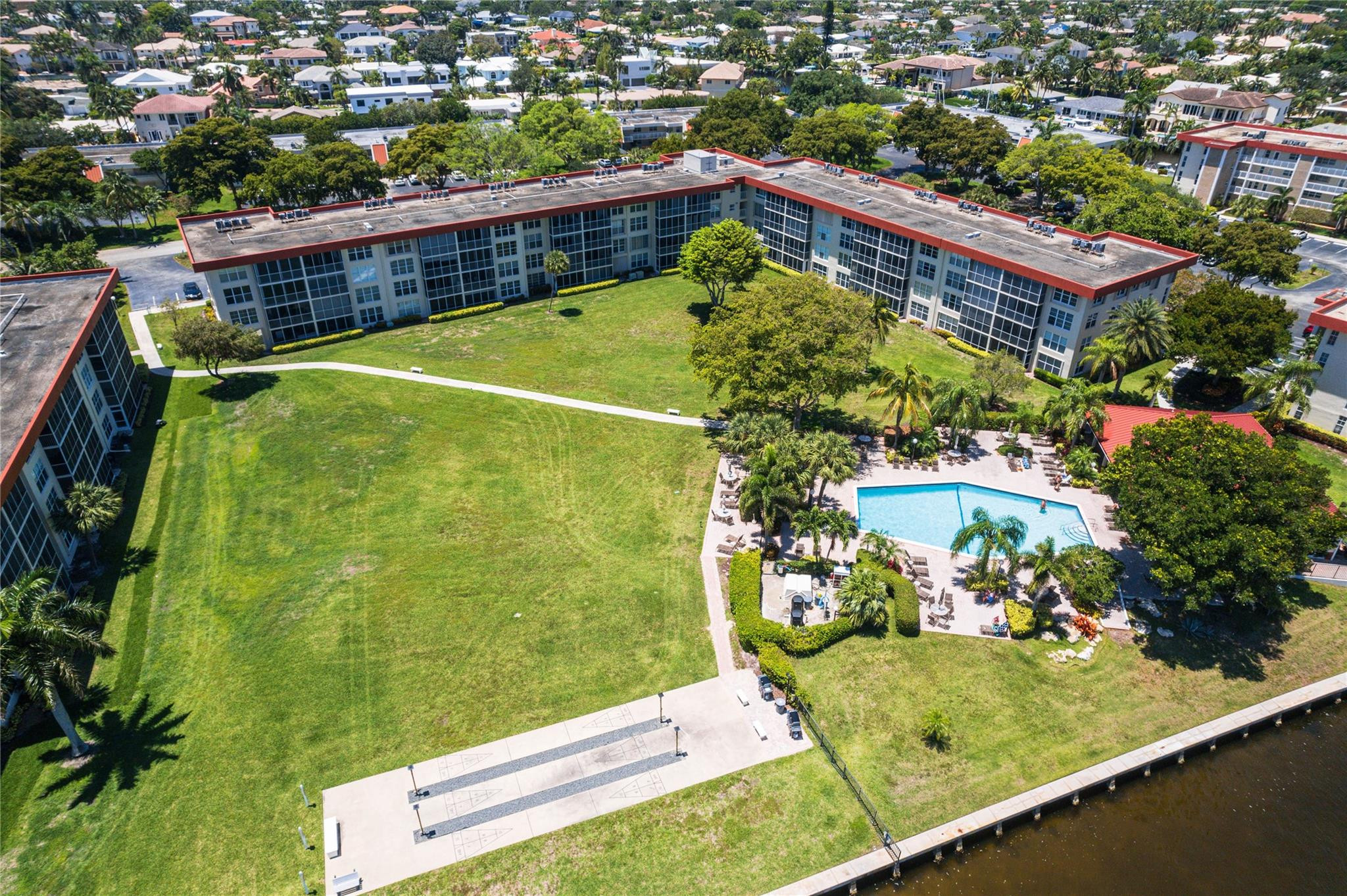 3150 Northeast 48th Court, Unit 414 Lighthouse Point, FL 33064 - Photo 30 of 33 a view of a swimming pool with a patio