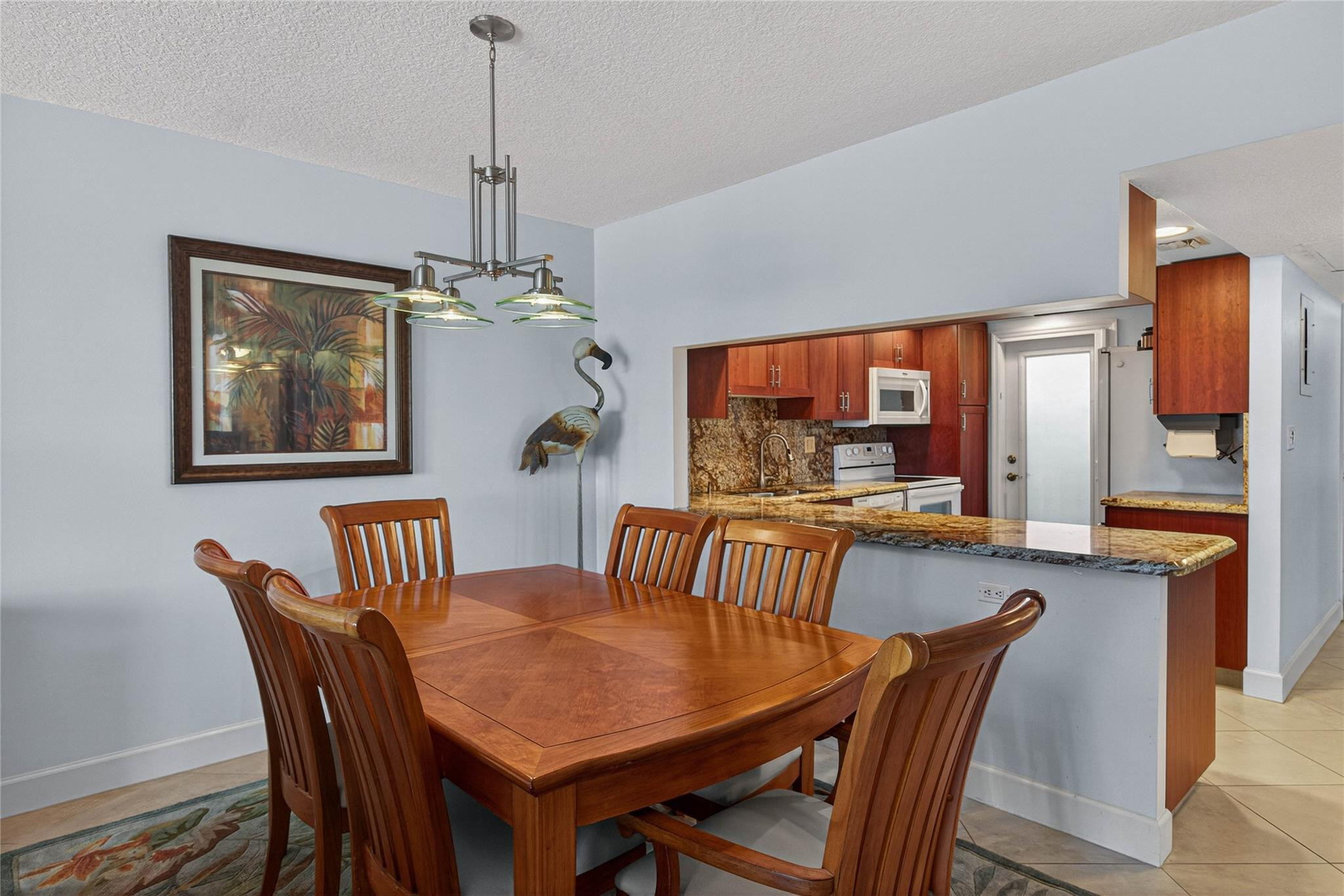 3150 Northeast 48th Court, Unit 414 Lighthouse Point, FL 33064 - Photo 7 of 33 a view of a dining room with furniture window and outside view