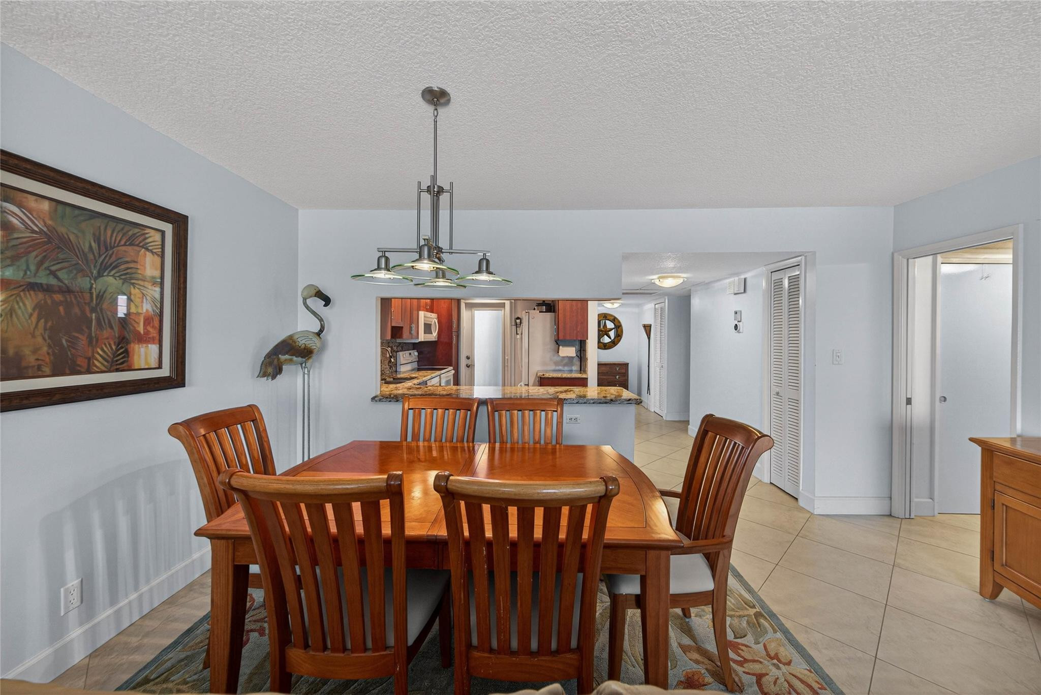 3150 Northeast 48th Court, Unit 414 Lighthouse Point, FL 33064 - Photo 9 of 33 a view of a dining room with furniture