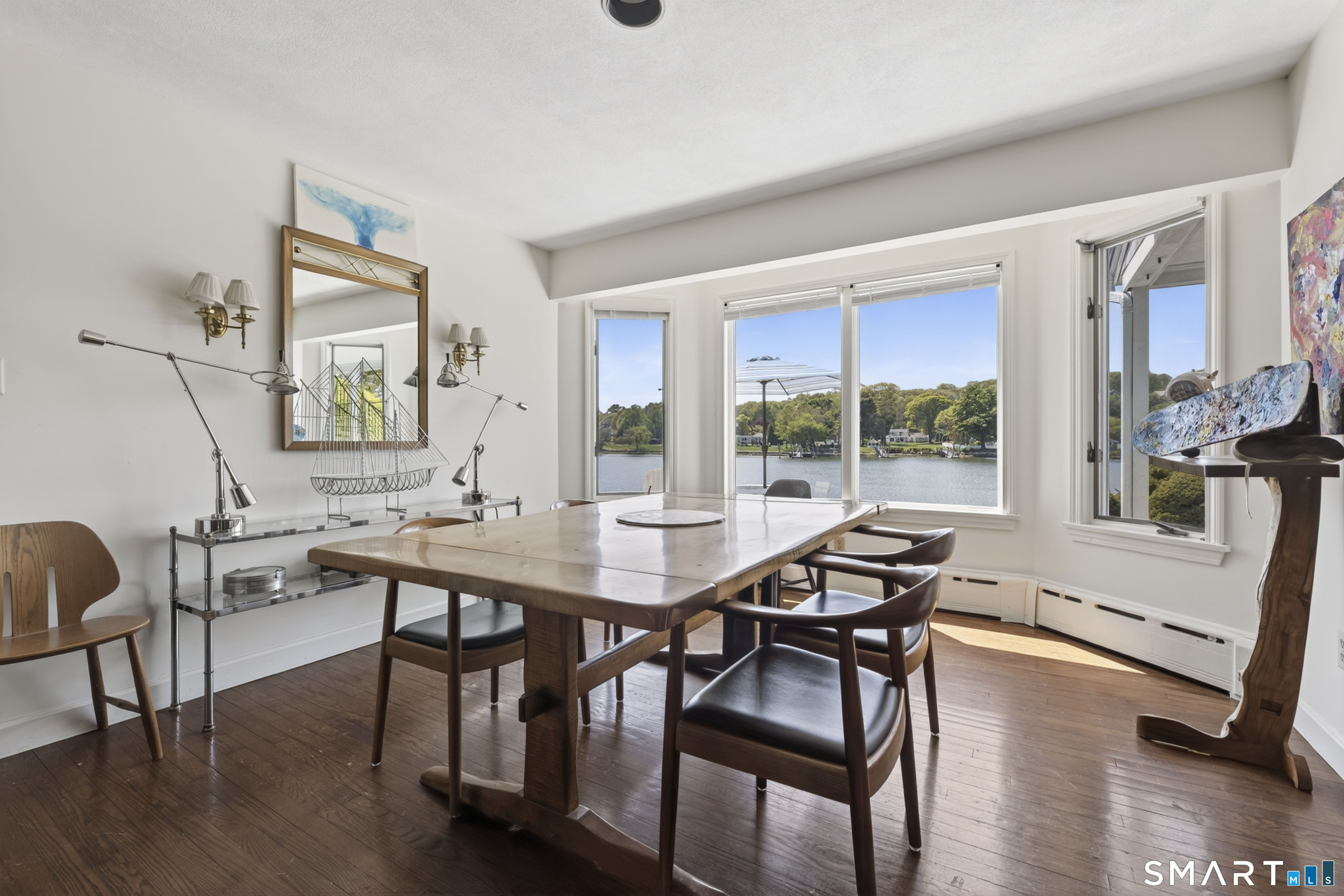 27 Wilbur Road Stonington, CT 06378 - Photo 10 of 40 a view of a dining room with furniture window and wooden floor