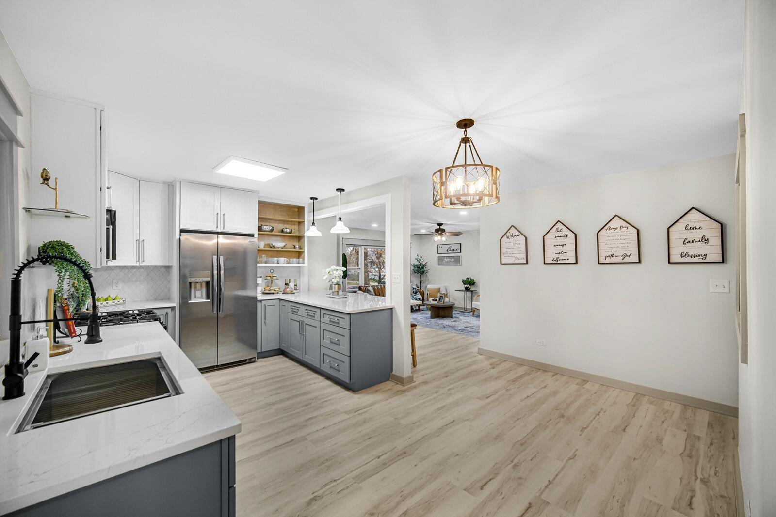 7405 South McCook Avenue Hammond, IN 46323 - Photo 6 of 28 a kitchen with refrigerator and cabinets