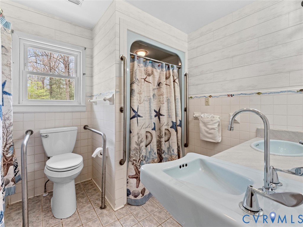 10488 Old Telegraph Road Ashland, VA 23005 - Photo 55 of 69 a bathroom with a sink toilet and shower