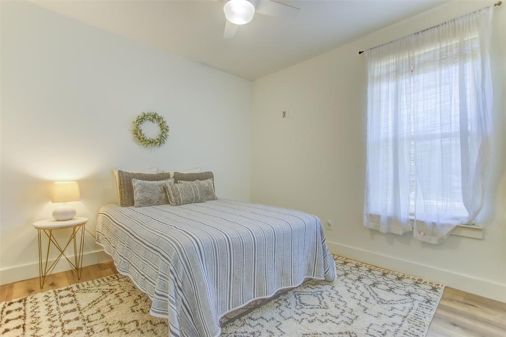 550 Capstone Rdg Road Santo, TX 76472 - Photo 21 of 40 Bedroom featuring baseboards, wood finished floors, and a ceiling fan