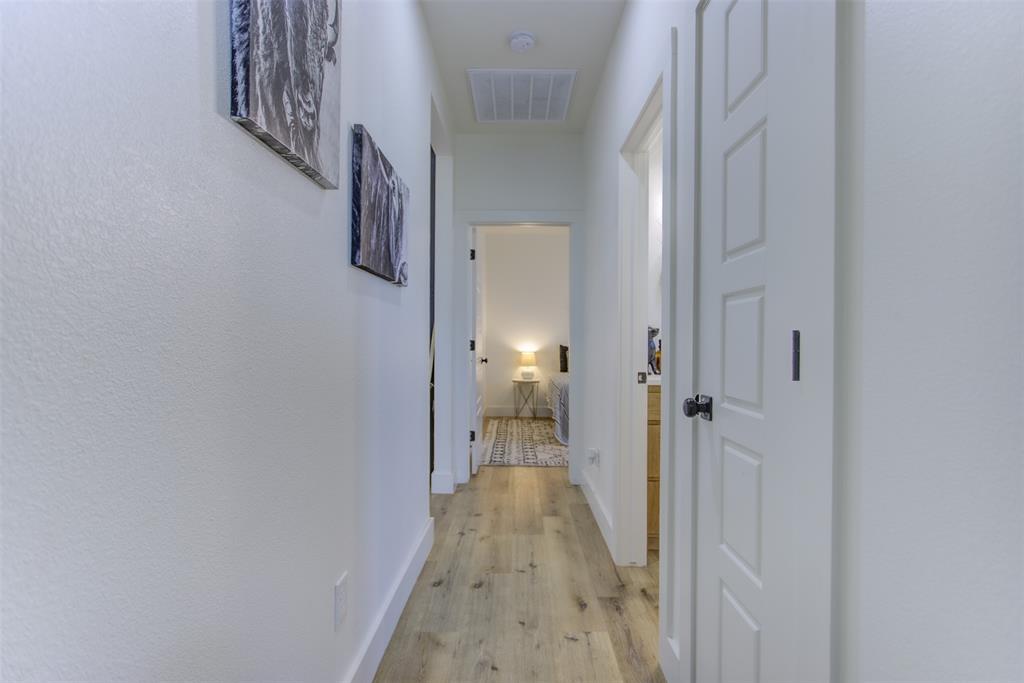 550 Capstone Rdg Road Santo, TX 76472 - Photo 25 of 40 Hall featuring light wood finished floors and baseboards