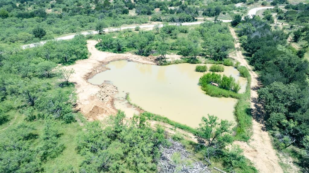 550 Capstone Rdg Road Santo, TX 76472 - Photo 37 of 40 Aerial view of property and surrounding area featuring a nearby body of water