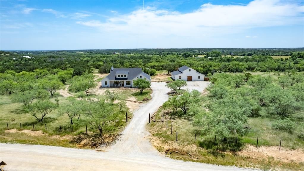 550 Capstone Rdg Road Santo, TX 76472 - Photo 5 of 40 View from above of property featuring a heavily wooded area